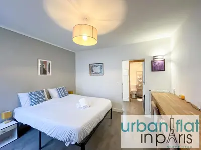 Un ou plusieurs lits dans un hébergement de l'établissement UrbanFlat 195 - Cosy Triplex in center of Paris
