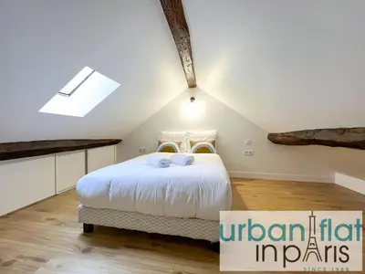 Un ou plusieurs lits dans un hébergement de l'établissement UrbanFlat 195 - Cosy Triplex in center of Paris