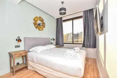 Un ou plusieurs lits dans un hébergement de l'établissement Stunning apartment - 1BR 4P - Opéra Garnier