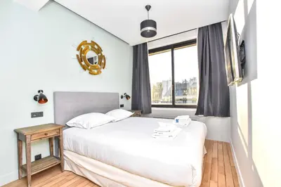 Un ou plusieurs lits dans un hébergement de l'établissement Stunning apartment - 1BR 4P - Opéra Garnier