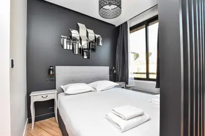 Un ou plusieurs lits dans un hébergement de l'établissement Chic studio w jacuzzi - 2P - near Palais Garnier