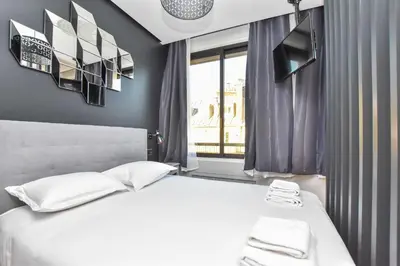 Un ou plusieurs lits dans un hébergement de l'établissement Chic studio w jacuzzi - 2P - near Palais Garnier