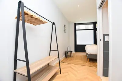 Un ou plusieurs lits dans un hébergement de l'établissement Central Apartement 6p L004