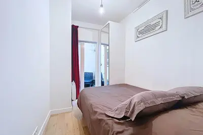 Un ou plusieurs lits dans un hébergement de l'établissement Charming pied-à-terre near Sacré Coeur