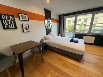 Un ou plusieurs lits dans un hébergement de l'établissement Residence Issy