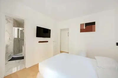 Un ou plusieurs lits dans un hébergement de l'établissement Superb apt a c – 2BR 6P – St Germain-des-Prés