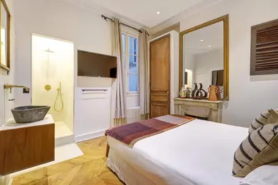 Un ou plusieurs lits dans un hébergement de l'établissement NoChichi Collections - Grand Rex
