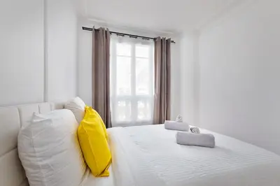 Un ou plusieurs lits dans un hébergement de l'établissement 3P Cocooning prés Paris La Défense Champs Élysées