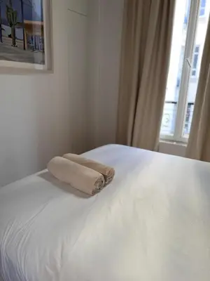 Un ou plusieurs lits dans un hébergement de l'établissement Elegant appartment Parisian