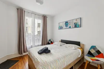 Un ou plusieurs lits dans un hébergement de l'établissement Charming Paris Apt, Metro 4 & RER B, 6 guests, CDG Access, 1-2 Rooms