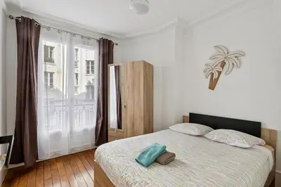 Un ou plusieurs lits dans un hébergement de l'établissement Charming Paris Apt, Metro 4 & RER B, 6 guests, CDG Access, 1-2 Rooms