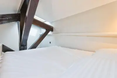 Un ou plusieurs lits dans un hébergement de l'établissement Elegant studio en mezzanine - Parc Monceau