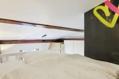 Un ou plusieurs lits dans un hébergement de l'établissement Grand Studio Elegant Parc Monceau