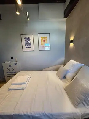 Un ou plusieurs lits dans un hébergement de l'établissement Studio de Luxe Parc Monceau