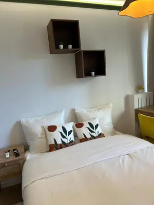 Un ou plusieurs lits dans un hébergement de l'établissement Grand 5 Chambres Paris La Defense