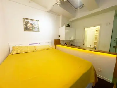 Un ou plusieurs lits dans un hébergement de l'établissement Cozy House Notre-Dame