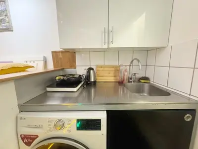 Cuisine ou kitchenette dans l'établissement Cozy House Notre-Dame