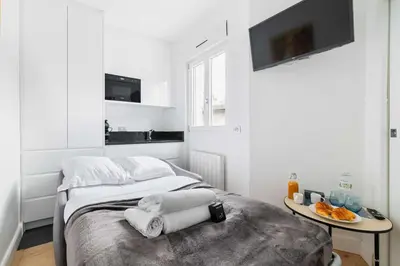 Un ou plusieurs lits dans un hébergement de l'établissement Studio cosy metro pereire paris 17 - 2P