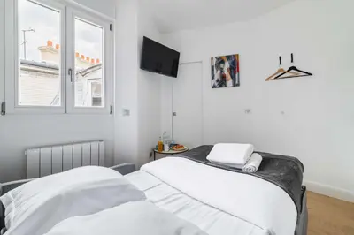 Un ou plusieurs lits dans un hébergement de l'établissement Studio cosy metro pereire paris 17 - 2P