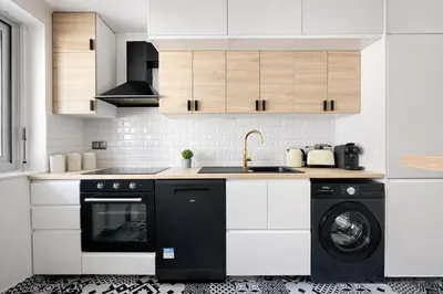 Cuisine ou kitchenette dans l'établissement Appartement charmant au coeur du 16eme