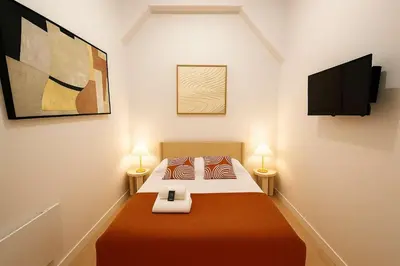 Un ou plusieurs lits dans un hébergement de l'établissement 2 pieces avec mezzanine et deco design - Paris 9