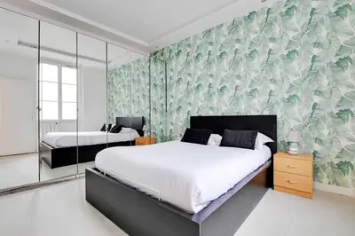 Un ou plusieurs lits dans un hébergement de l'établissement Appartement Paris 4 Proche Bastille Confort