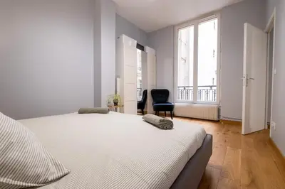 Un ou plusieurs lits dans un hébergement de l'établissement Luxury Flat Champs Elysées 4 Guests