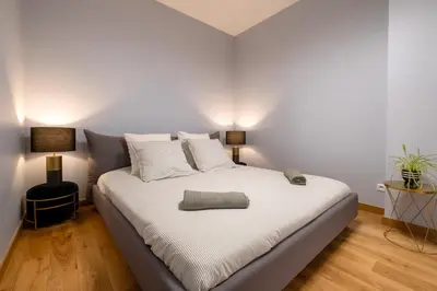 Un ou plusieurs lits dans un hébergement de l'établissement Luxury Flat Champs Elysées 4 Guests