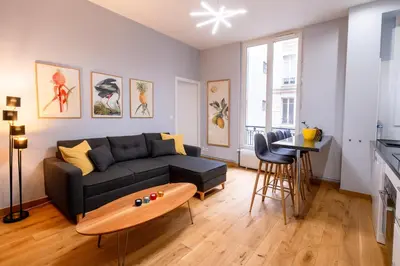 Coin salon dans l'établissement Luxury Flat Champs Elysées 4 Guests