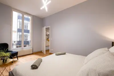 Un ou plusieurs lits dans un hébergement de l'établissement Luxury Flat Champs Elysées 4 Guests
