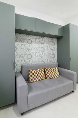 Coin salon dans l'établissement Appartement metro jaures tout equipe - Paris 19