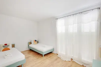 Un ou plusieurs lits dans un hébergement de l'établissement PARIS 10 - Luxury flat L024