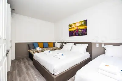 Un ou plusieurs lits dans un hébergement de l'établissement Cosy appt - Grands boulevards Musee Grevin