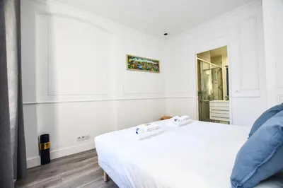 Un ou plusieurs lits dans un hébergement de l'établissement Cosy appt - Grands boulevards Musee Grevin