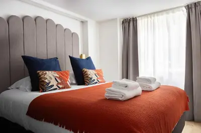 Un ou plusieurs lits dans un hébergement de l'établissement Bright Loft - 2BR 6P - close to Montmartre
