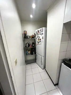 Cuisine ou kitchenette dans l'établissement Bel appartement asniere sur seine