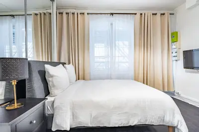 Un ou plusieurs lits dans un hébergement de l'établissement Chic Studio - Rivoli