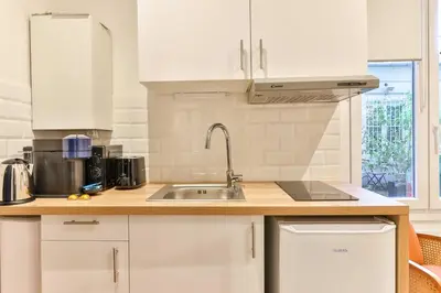 Cuisine ou kitchenette dans l'établissement Modern deluxe studio in the heart of Paris