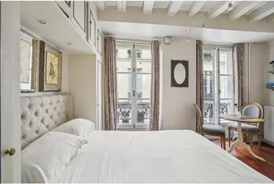 Un ou plusieurs lits dans un hébergement de l'établissement Studio Cosy Musee du Louvre - Paris 7 - 2P