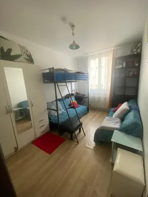 Un ou plusieurs lits dans un hébergement de l'établissement Le Petit Nid à Paris XI