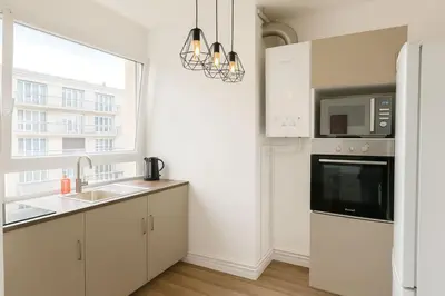 Cuisine ou kitchenette dans l'établissement Appartement Paisible pont de saint cloud - 4P