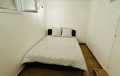 Un ou plusieurs lits dans un hébergement de l'établissement 2-bedrooms apart near the Eiffel Tower