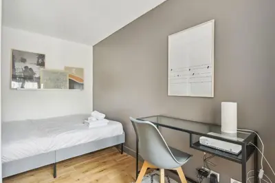 Un ou plusieurs lits dans un hébergement de l'établissement BnBNova - 2BR - Les Halles & Le Marais