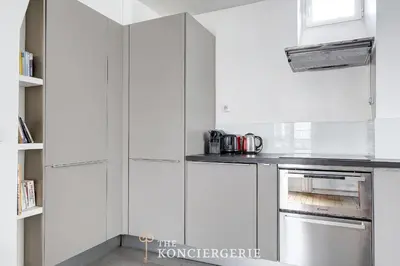 Cuisine ou kitchenette dans l'établissement BM-Nid Cosy a Oberkampf - pour Deux