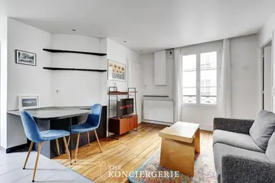 Coin salon dans l'établissement BM-Nid Cosy a Oberkampf - pour Deux