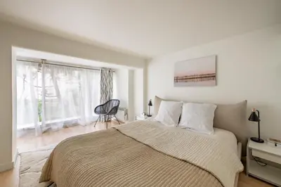 Un ou plusieurs lits dans un hébergement de l'établissement Elegant apartment near Trocadéro