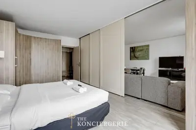 Un ou plusieurs lits dans un hébergement de l'établissement Appartement de 3 chambres avec Balcon à proximité de l'Arc de triomphe