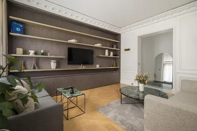 Télévision ou salle de divertissement dans l'établissement My Paris Apartments - Marbeuf