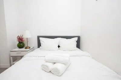 Un ou plusieurs lits dans un hébergement de l'établissement Cozy studio near Invalides