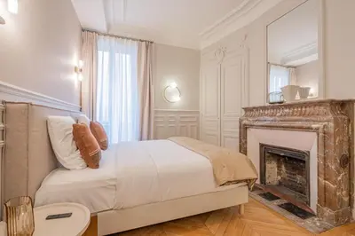 Un ou plusieurs lits dans un hébergement de l'établissement My Paris Apartments - Saint Germain
